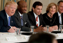 Record - President Donald Trump, left, talks the White House with manufacturing executives on the Feb. 23, 2017.