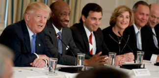 Record - President Donald Trump, left, talks the White House with manufacturing executives on the Feb. 23, 2017.