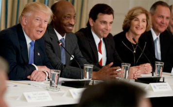 Record - President Donald Trump, left, talks the White House with manufacturing executives on the Feb. 23, 2017.