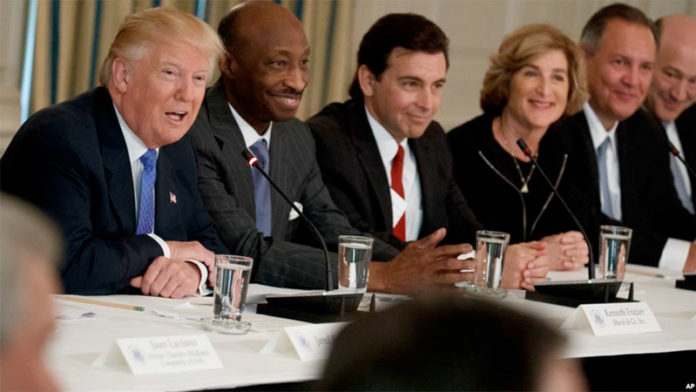 donald Trump Record - President Donald Trump, left, talks the White House with manufacturing executives on the Feb. 23, 2017.